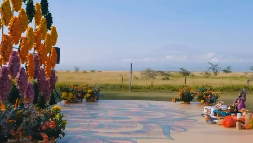 Open-air floral stage with a colourful patterned floor